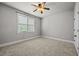 Bedroom features neutral walls, ceiling fan and a window for natural light at 1124 Kalworth Rd, Wake Forest, NC 27587