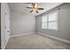 Bedroom features neutral walls, ceiling fan and a window for natural light at 1124 Kalworth Rd, Wake Forest, NC 27587