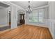 Dining area featuring hardwood floors, trim and large window with natural light at 1124 Kalworth Rd, Wake Forest, NC 27587
