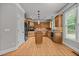 Gourmet kitchen features stainless steel appliances, wooden cabinets, and an island at 1124 Kalworth Rd, Wake Forest, NC 27587