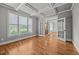 Bright living room with coffered ceilings, hardwood floors, and French doors at 1124 Kalworth Rd, Wake Forest, NC 27587