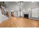Spacious living room with fireplace, ceiling fan, and large windows at 1124 Kalworth Rd, Wake Forest, NC 27587