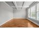 Inviting room featuring hardwood floors, large windows, and neutral walls at 1124 Kalworth Rd, Wake Forest, NC 27587