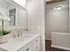 Bathroom featuring a quartz countertop vanity, modern faucet, and decorative accents at 118 Rhum Pl, Garner, NC 27529