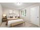 Relaxing bedroom with a comfortable bed, soft lighting, and ample natural light from the window at 118 Rhum Pl, Garner, NC 27529