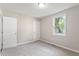 A bedroom with a window that brings in ample light and soft carpeted floors at 118 Rhum Pl, Garner, NC 27529