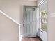 Inviting entryway with decorative gray front door and staircase leading to the upper level at 118 Rhum Pl, Garner, NC 27529
