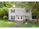 Charming duplex features a manicured lawn, and traditional architectural details and is shaded by mature trees at 118 Rhum Pl, Garner, NC 27529