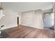 Bright living room featuring hardwood floors, fresh neutral paint, and a gray front door at 118 Rhum Pl, Garner, NC 27529