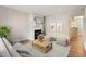 Bright living room featuring a fireplace, hardwood floors, and neutral colors at 118 Rhum Pl, Garner, NC 27529
