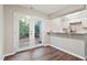 Open layout with backyard access; features stainless appliances, quartz counters, and hardwood floors at 118 Rhum Pl, Garner, NC 27529