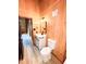 A wood-walled bathroom features a white vanity, toilet, and light-colored flooring at 1283 Ennis Rd, Angier, NC 27501
