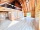 Spacious open-concept living area features wood walls, high ceilings, and loft space above at 1283 Ennis Rd, Angier, NC 27501