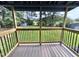 View from the covered porch looking out to the backyard and sheds at 1283 Ennis Rd, Angier, NC 27501
