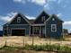 Beautiful single-Gathering home showcasing its meticulous landscaping and inviting facade on a sunny day at 129 Retreat Run, Smithfield, NC 27577