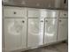 Close up of a white kitchen cabinet with plastic protection and silver handles at 129 Retreat Run, Smithfield, NC 27577