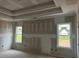 A spacious main bedroom featuring two windows providing natural light and a unique ceiling design at 129 Retreat Run, Smithfield, NC 27577