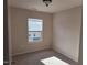 Cozy bedroom with neutral carpet and a window that allows plenty of natural light at 1304 Cozart St # 119, Durham, NC 27704