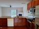 Well-equipped kitchen with stainless steel appliances, wood cabinets, and granite countertops at 1304 Cozart St # 119, Durham, NC 27704