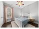 Cozy bedroom with hardwood floors, natural light, and comfortable decor at 1324 Sandybrook Ln, Wake Forest, NC 27587
