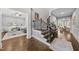 Open foyer with wood floors, stairs, and views into multiple rooms at 1324 Sandybrook Ln, Wake Forest, NC 27587