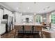 Spacious kitchen with large island, granite countertops, stainless steel appliances, and adjacent dining area at 1324 Sandybrook Ln, Wake Forest, NC 27587