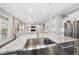 Open concept kitchen with granite counters and stainless steel appliances at 1324 Sandybrook Ln, Wake Forest, NC 27587
