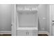 Hall tree style mudroom provides ample storage in this hallway at 1324 Sandybrook Ln, Wake Forest, NC 27587