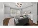 Bright playroom with comfortable seating, natural light, and plenty of space for activities at 1324 Sandybrook Ln, Wake Forest, NC 27587