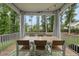Relaxing screened-in porch with a dining table, chairs and backyard views at 1324 Sandybrook Ln, Wake Forest, NC 27587