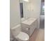 A modern bathroom featuring a white vanity, toilet, and tile floors at 137 Wintermist Dr, Cary, NC 27513