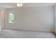 Spacious bedroom with neutral carpeting, natural light, and ceiling fan at 137 Wintermist Dr, Cary, NC 27513