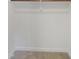 A clean and tidy closet with a wooden clothes rod for organized storage at 137 Wintermist Dr, Cary, NC 27513