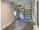 Spacious garage with a functional door, side door, and ample room for parking and storage at 137 Wintermist Dr, Cary, NC 27513