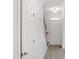 Inviting hallway with hardwood floors, white trim, a staircase, and a front door at 137 Wintermist Dr, Cary, NC 27513