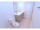 Bright bathroom featuring double vanity, light tile floors, and a separate toilet room for added privacy at 1441 Rosepine Dr Dr, Cary, NC 27519