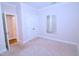 Bright bedroom with neutral carpet, mirror, and a closet at 1441 Rosepine Dr Dr, Cary, NC 27519