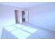 Bedroom with two open doors and neutral carpeting at 1441 Rosepine Dr Dr, Cary, NC 27519