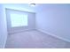 Bright bedroom with a window with blinds and neutral carpeting at 1441 Rosepine Dr Dr, Cary, NC 27519