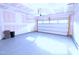 Garage with blue epoxy floors and a closed white garage door, ready for parking or storage at 1441 Rosepine Dr Dr, Cary, NC 27519