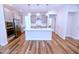 Bright kitchen with stainless steel appliances, white countertops, subway tile backsplash, and modern pendant lighting at 1441 Rosepine Dr Dr, Cary, NC 27519