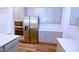 Bright kitchen with stainless steel appliances, white countertops, and gray cabinets at 1441 Rosepine Dr Dr, Cary, NC 27519