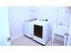 Well-lit laundry room with modern appliances and a utility sink, for functional convenience at 1441 Rosepine Dr Dr, Cary, NC 27519