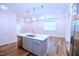 Open concept living room with bright kitchen and hardwood floors at 1441 Rosepine Dr Dr, Cary, NC 27519