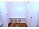 White mudroom includes a bench with storage cubbies and coat hooks at 1441 Rosepine Dr Dr, Cary, NC 27519