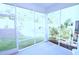 Enclosed screened porch with views of the green backyard and natural surroundings at 1441 Rosepine Dr Dr, Cary, NC 27519