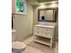 Bathroom featuring a toilet, vanity with a white countertop, and a mirror at 1512 Cumberland Rd, Chapel Hill, NC 27514