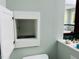 Bathroom featuring a cabinet, sink, and vanity with brass fixtures at 1512 Cumberland Rd, Chapel Hill, NC 27514