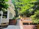 Exterior view of home's deck surrounded by trees at 1512 Cumberland Rd, Chapel Hill, NC 27514