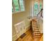 An open foyer with soaring windows and a decorative chandelier highlights the hardwood staircase and elegant entrance at 1512 Cumberland Rd, Chapel Hill, NC 27514
